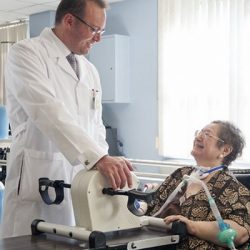 Evidence Based Support for Using a PMV® In-line with Mechanical Ventilation Doctor checking up on ventilated patient with a PMV007 inline